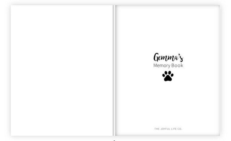 May include: A white book with the text "Gemma's Memory Book" and a black paw print. The text "THE JOYFUL LIFE CO." is at the bottom of the page.
