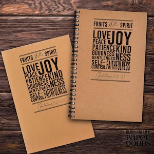 May include: Two brown spiral notebooks with the text "Fruits of the Spirit" and a list of words including "Love, Joy, Peace, Patience, Kindness, Goodness, Gentleness, Self-Control, Faithfulness" and the scripture reference "Galatians 5:22-23".