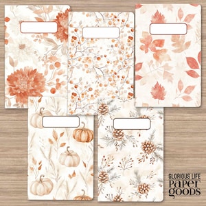 May include: Set of six printable notebook covers featuring autumnal designs. The covers feature various patterns including pumpkins, pinecones, leaves, and floral designs in shades of orange, brown, and white.