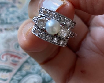 Art deco 3 stone pearl & European cut diamond cocktail ring with a filigree mounting. Collectable estate jewelry.