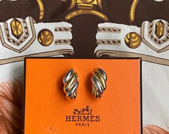 Vintage 1970s 18k yellow and white gold clip on earrings, signed Hermés French, Classic designer signature piece.