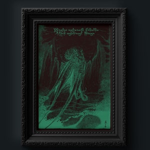 May include: A framed print with a green and maroon illustration of a tentacled creature, possibly Cthulhu. The artwork has text at the top and is in a black ornate frame. The style is dark and gothic, with a vintage feel.