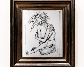 May include: A framed black and white sketch of a seated figure with a bird-like head. The artwork is in a dark brown wooden frame. The figure is nude, with arms crossed, and legs drawn up.