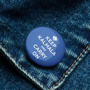 May include: Blue button with white text that reads "Keep Kalmala and Carry On". A white lotus flower is above the word "Keep".