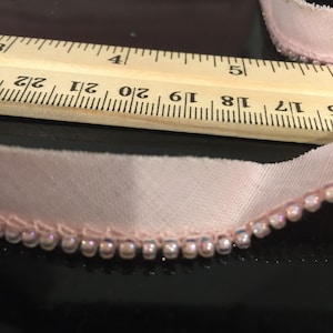 1/2” wide iridescent pink glass bead edging by the 10 yard piece