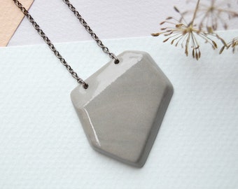 Porcelain necklace. Pendant. Mixed Gray color. With chain. Design. Contemporary look. Boho chic