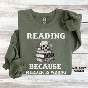 May include: A green sweatshirt with the text "Reading because murder is wrong" and a skull with a stack of books.