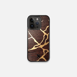 May include: A dark brown phone case with a gold crackle design. The case has a black camera cutout and a black X logo.