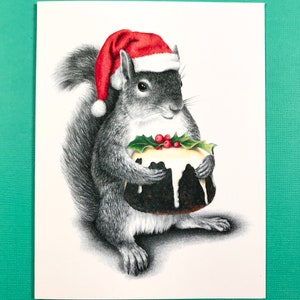 Carte de vœux Écureuil du Père Noël avec pudding aux figues, intérieur vierge, taille A2