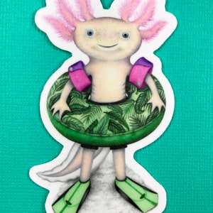 May include: A white axolotl wearing pink arm floaties and a green tropical leaf print inner tube. The axolotl is wearing green flippers and has a white tail.