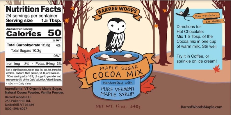 May include: A blue mug with a brown owl perched on the rim, filled with hot chocolate and marshmallows. The mug is surrounded by fall leaves and the text "Maple Sugar Cocoa Mix" is written in orange and brown. The text "Handcrafted with Pure Vermont Maple Syrup" is written in black below the mug. The product is a 12 ounce (340g) bag of maple sugar cocoa mix.