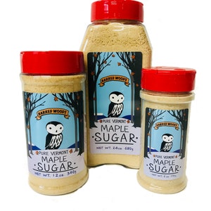 May include: Three glass jars of maple sugar, labeled "Barred Woods Pure Vermont Maple Sugar" with an owl logo. The jars are 6 oz, 12 oz, and 24 oz.