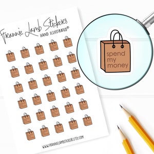 May include: A sheet of stickers featuring a brown shopping bag with the text "spend my money" repeated multiple times. The stickers are hand-illustrated and perfect for planners, journals, and other creative projects.