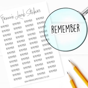 May include: A sheet of Frannie Lamb Stickers featuring the word REMEMBER printed in black ink multiple times. A magnifying glass enlarges one sticker, and the text WWW.FRANNIELAMBSTICKERS.ETSY.COM is printed at the bottom of the white paper sheet.