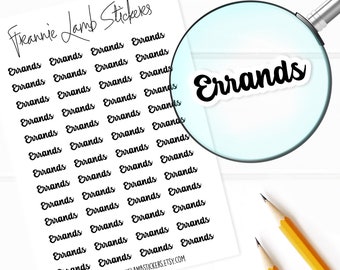 May include: A white sticker sheet titled Frannie Lamb Stickers featuring multiple black script text stickers that read Errands. A magnifying glass highlights one individual Errands sticker, and two yellow pencils are positioned nearby.