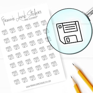 May include: A sheet of 50 black and white floppy disk stickers. The stickers are hand-illustrated and feature a simple outline of a floppy disk. The sheet is labeled "Frannie Lamb Stickers" and "Hand Illustrated".