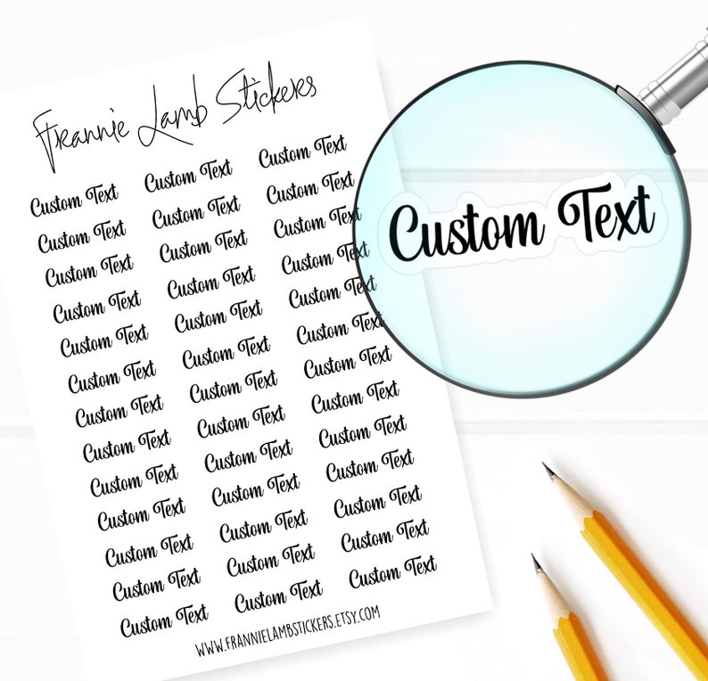 May include: A sheet of white paper with black text that reads "Freannie Lamb Stickers" and "Custom Text" repeated multiple times. A magnifying glass is over the text "Custom Text".