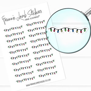 May include: A sheet of stickers featuring multiple rows of string lights with red, green, blue, and yellow bulbs. The text "Frannie Lamb Stickers" and "Hand Illustrated" is at the top of the sheet. The text "www.frannielambstickers.etsy.com" is at the bottom of the sheet.