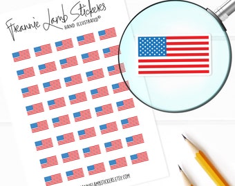 May include: A sheet of stickers featuring 36 small American flag designs. The flags are red, white, and blue with a white background. The sheet is labelled "Frannie Lamb Stickers" and "Hand Illustrated".