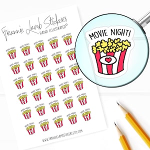 May include: A sheet of 36 stickers featuring a cartoon illustration of a red and white popcorn bucket with yellow popcorn and the text "Movie Night!" The stickers are on a white background.