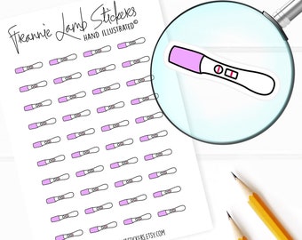 May include: A sheet of 40 pink and white pregnancy test stickers. The stickers are hand-illustrated and feature a simple design of a pregnancy test with two lines. The text "Frannie Lamb Stickers" and "Hand Illustrated" is at the top of the sheet. The text "www.frannielambstickers.etsy.com" is at the bottom of the sheet.