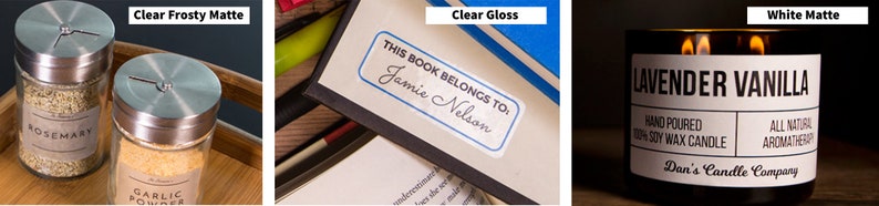 May include: Three labels with different finishes: clear frosty matte, clear gloss, and white matte. The labels are on various products, including spice jars, a book, and a candle. The text on the labels reads "Rosemary", "Garlic Powder", "This book belongs to Jamie Nelson", and "Lavender Vanilla".