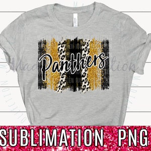May include: A grey t-shirt with a black and gold graphic design featuring the word "Panthers" in black script with a leopard print and gold glitter accents.