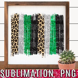 May include: A digital download of a sublimation design featuring a vertical arrangement of five stripes in leopard print, silver glitter, green glitter, black glitter, and a second leopard print. The design is set against a white background.