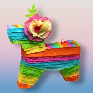 May include: A vibrant donkey piñata constructed from layered crepe paper in blue, green, yellow, orange, and pink. It has a large paper flower and green leaves on its head, perfect for parties and celebrations.