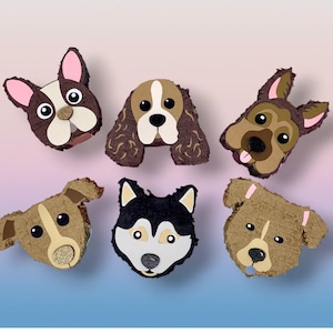 May include: Six dog-shaped piñatas, each designed to look like a different breed. The piñatas are in various colours, including brown, black, white, and tan, with details such as pink ears and glitter accents. They are arranged on a gradient background.