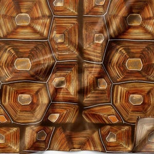 May include: A fabric textile featuring a repeating geometric pattern that mimics the texture and appearance of a tortoise shell. The design consists of brown, tan, and dark amber hexagonal shapes outlined with thin, crisp white lines.