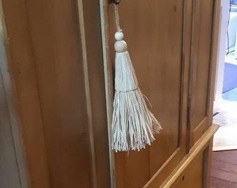 Kwastje, deurpompon, ornament van raffia
