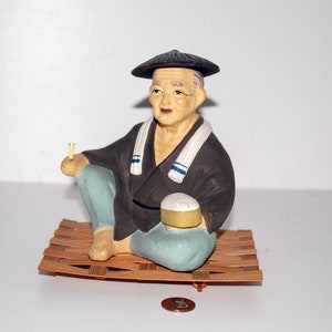 Japanese Hakata Doll of A Worker Eating His Meal Of Rice Seated on Tatami Mat