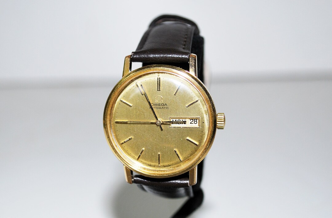 omegaアンティーク腕時計 1974 Omega Automatic Day Date Ref. 166.0117 Gold Tone Wristwatch