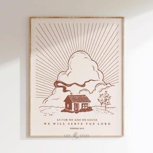 Peut inclure: Impression d'art encadr&eacute;e avec une illustration marron d'une maison, d'un nuage et d'un motif de rayons de soleil. Le texte dit : &laquo; Pour moi et ma maison, nous servirons le Seigneur, Josu&eacute; 24:15 &raquo;. L'&oelig;uvre est dans un cadre en bois.