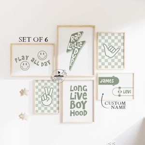 May include: Set of six green and white illustrated wall art prints with a skateboard theme. The prints feature phrases like "Rad Little Dude", "Play All Day", "Long Live Boy Hood", and "Custom Name".