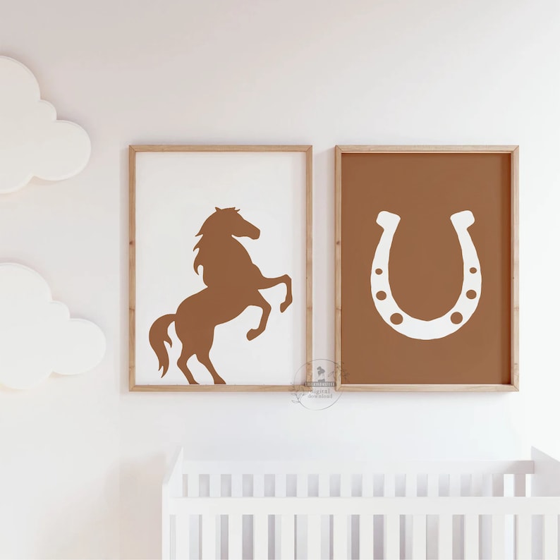 May include: Two framed prints with a brown background. The print on the left features a brown silhouette of a horse rearing up. The print on the right features a white horseshoe on a brown background.