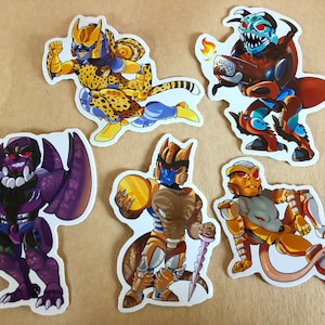 以下が含まれることがあります： 紫と黒のロボット、黄色と茶色のロボット、金のロボット、青と黄色のロボット、金と茶色のロボット、青と茶色のロボットなど、カラフルな漫画のロボットのステッカー6枚セットです。