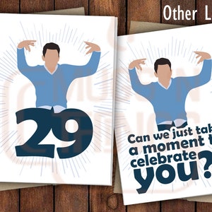 May include: A white greeting card with a blue illustration of a person with arms raised in the air. The number 29 is in the background. The text on the card reads "Can we just take a moment to celebrate you?!"
