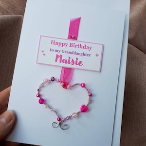 Happy Birthday Granddaughter, add your Granddaughters name and age - luxury greetings card with a keepsake heart ornament, personalised card