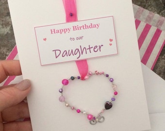 Happy birthday Daughter - a greetings card with a pretty keepsake heart decoration, personalised card.