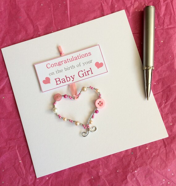 baby girl card newborn card congratulations on the birth of your baby girl a greeting card with a pretty keepsake heart decoration congratulations on your new baby girl