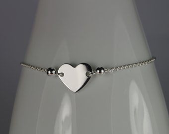 Sterling zilveren armband met hartvormige schuifsluiting en verstelbare ketting.