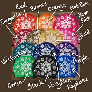 May include: Twelve silicone swim caps in a variety of colours, each featuring a white snowflake design. The colours include red, burgundy, bronze, orange, hot pink, neon pink, gold, purple, viridian, green, black, navy blue, and royal blue.