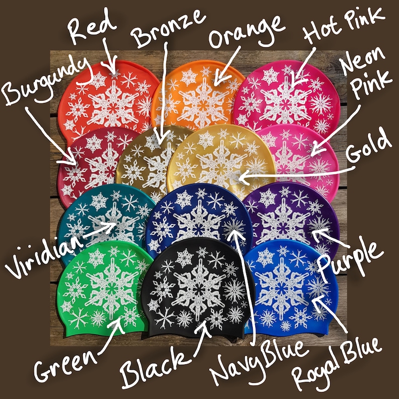 May include: Twelve silicone swim caps in a variety of colours, each featuring a white snowflake design. The colours include red, burgundy, bronze, orange, hot pink, neon pink, gold, purple, viridian, green, black, navy blue, and royal blue.