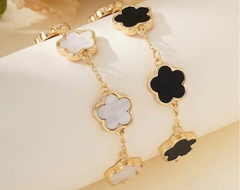 Conjunto de pulseras de trébol blanco y negro