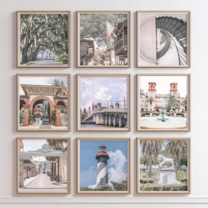 May include: A gallery wall set of nine square framed prints featuring architectural and landscape scenes from St. Augustine, Florida, including a tree-lined road, a spiral staircase, a historic bridge, a lighthouse, and various stone monuments.