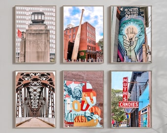 May include: Set of six framed art prints featuring urban scenes. Includes a stone monument with "Kentucky" inscribed, a large baseball bat, a colorful mural with the text "Together Our Future is Bright", a bridge, a mural with the word "Market", and a candy shop.