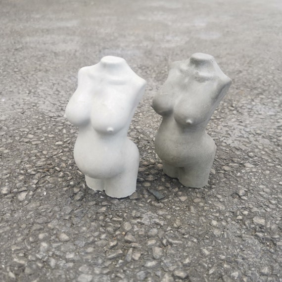 Pregnant woman naked concrete body statue