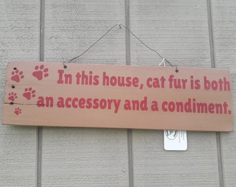 In this house cat fur is both an accessory and a condiment sign